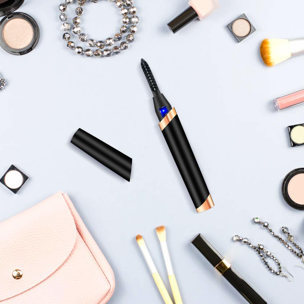 a heated eyelash curler currounded by other various beauty products